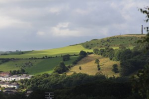 Early morning shadows cast shapes and add colour to the Iron Age hill fort of Pen Dinas.